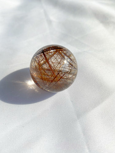Energizing Red Rutilated Quartz Sphere